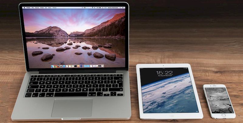 Laptop, tablet and cell phone on the table